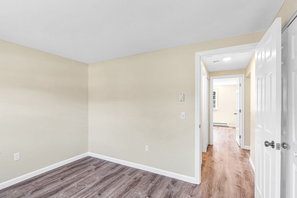 33 Maple Crest Circle, Unit D Holyoke, MA 01040 - Photo 21 of 28 a view of a room with wooden floor