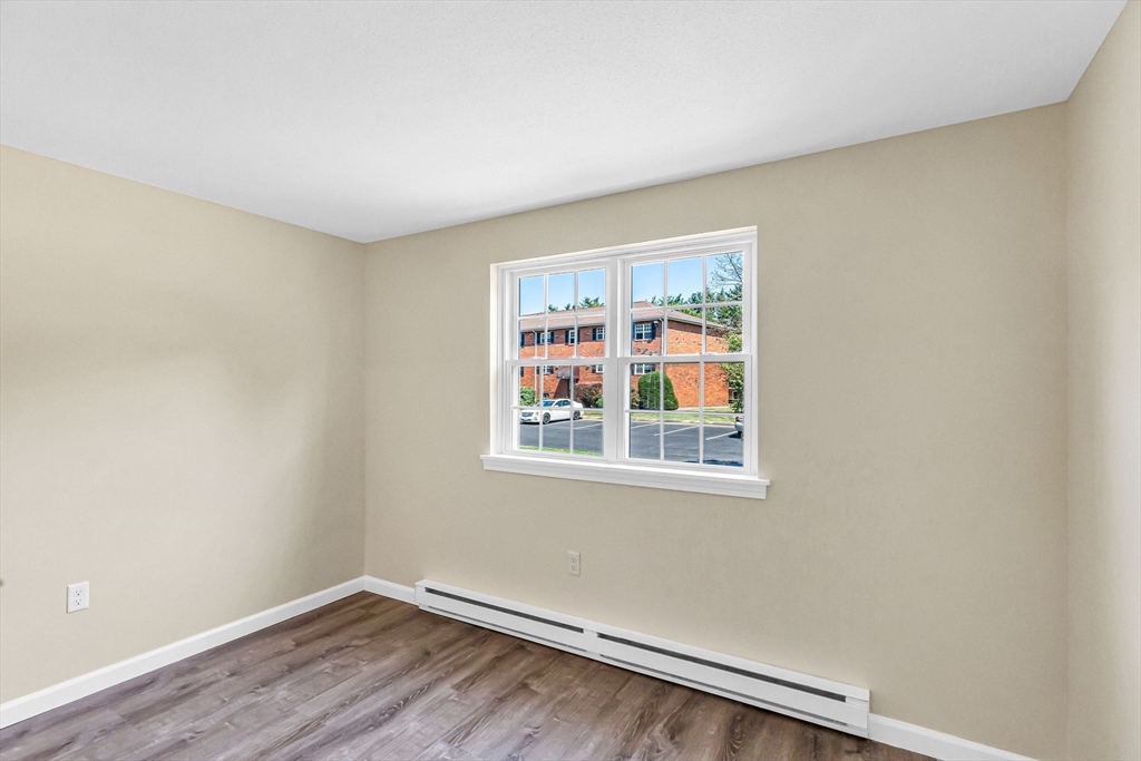 33 Maple Crest Circle, Unit D Holyoke, MA 01040 - Photo 24 of 28 an empty room with a window