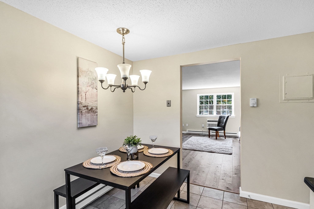 33 Maple Crest Circle, Unit D Holyoke, MA 01040 - Photo 5 of 28 a view of a livingroom with furniture and window
