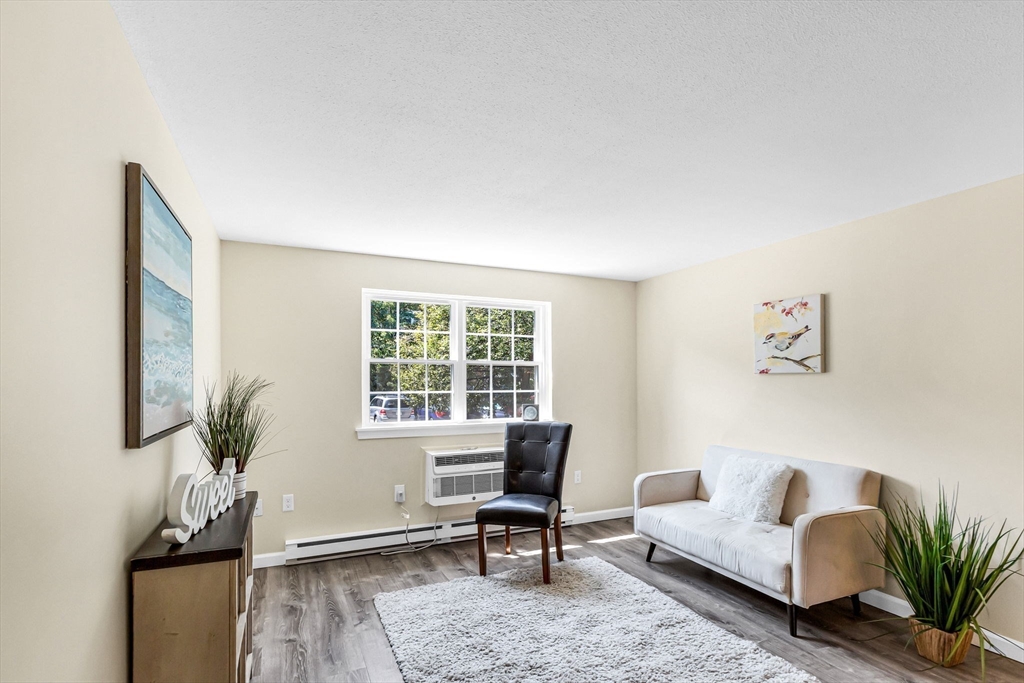 33 Maple Crest Circle, Unit D Holyoke, MA 01040 - Photo 6 of 28 a living room with furniture and wooden floor