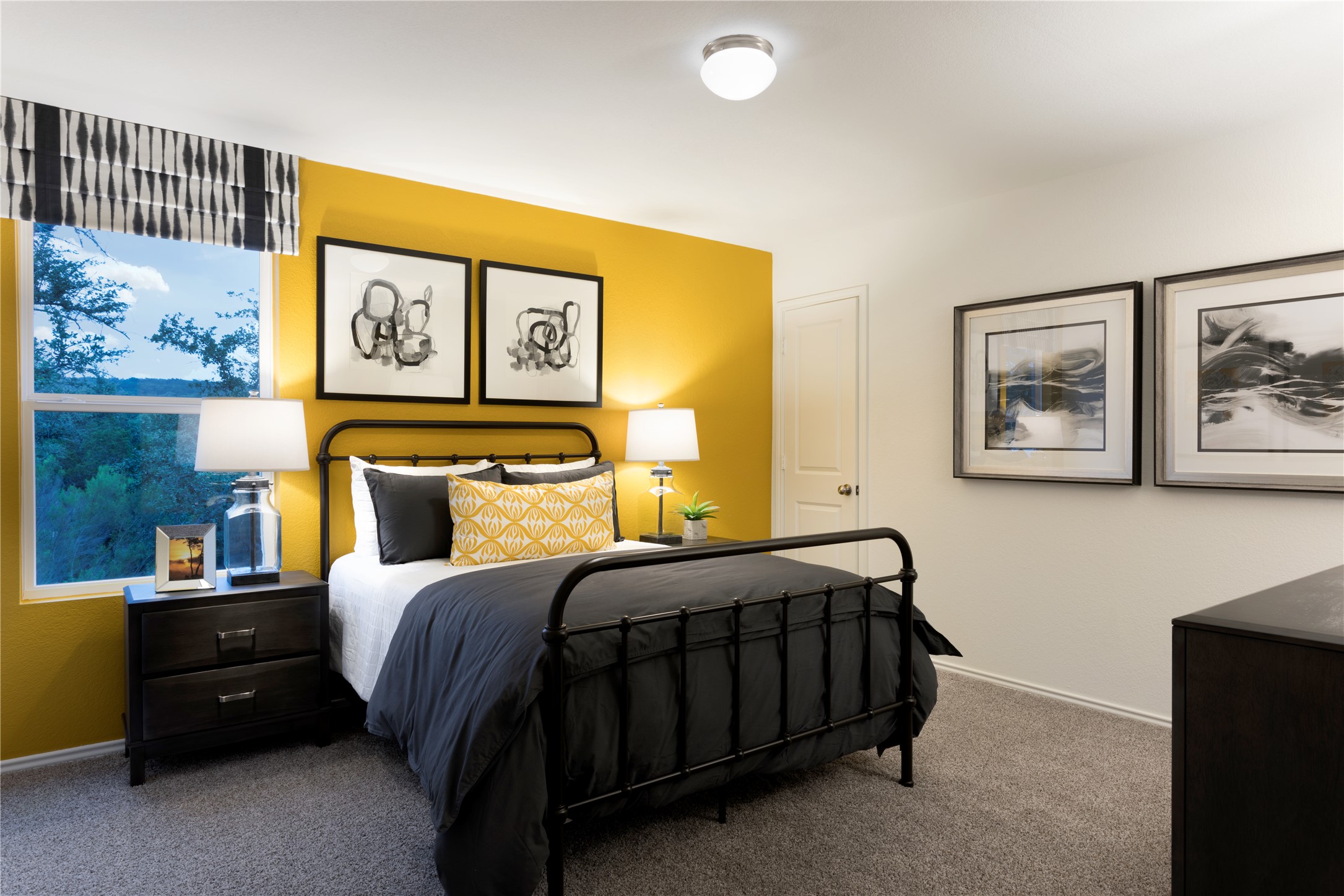 117 Sapling Dew Drive Georgetown, TX 78628 - Photo 5 of 22 a bedroom with a bed and wall painting