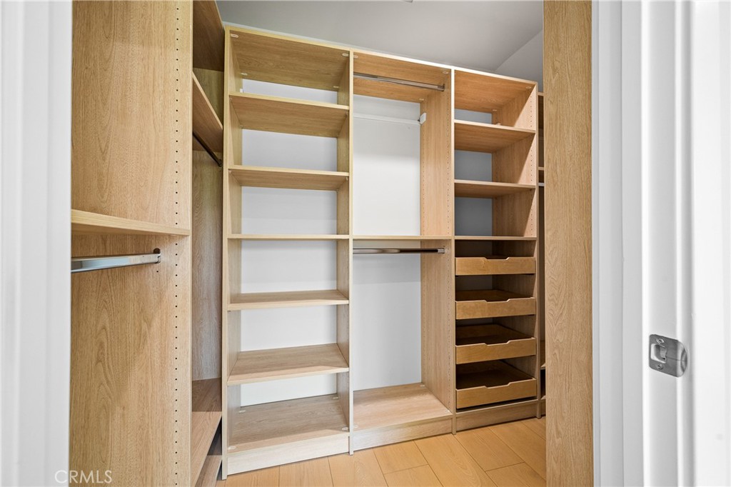 11431 De Celis Place Granada Hills, CA 91344 - Photo 12 of 20 a view of walk in closet with empty racks