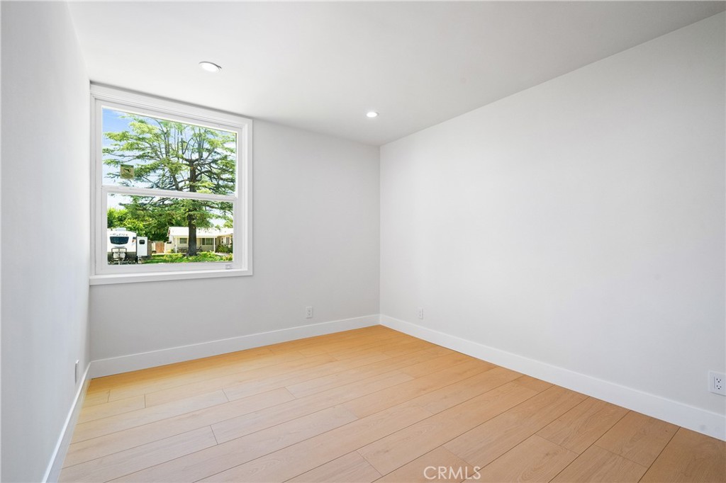 11431 De Celis Place Granada Hills, CA 91344 - Photo 15 of 20 a view of a big room with wooden floor and windows