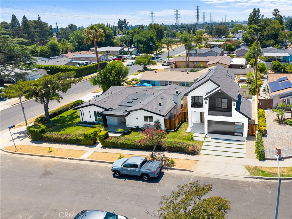 11431 De Celis Place Granada Hills, CA 91344 - Photo 2 of 20 an aerial view of a house with a garden and lake view