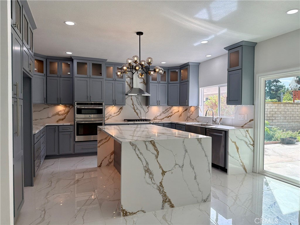 9455 Brandon Court Northridge, CA 91325 - Photo 5 of 15 a kitchen with stainless steel appliances granite countertop a sink and a stove