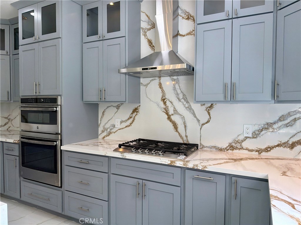9455 Brandon Court Northridge, CA 91325 - Photo 6 of 15 a kitchen with a stove and cabinets