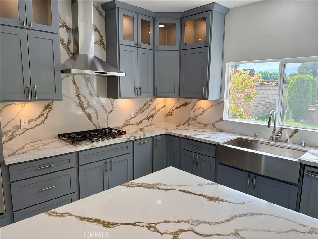9455 Brandon Court Northridge, CA 91325 - Photo 7 of 15 a kitchen with stainless steel appliances granite countertop a sink stove and refrigerator