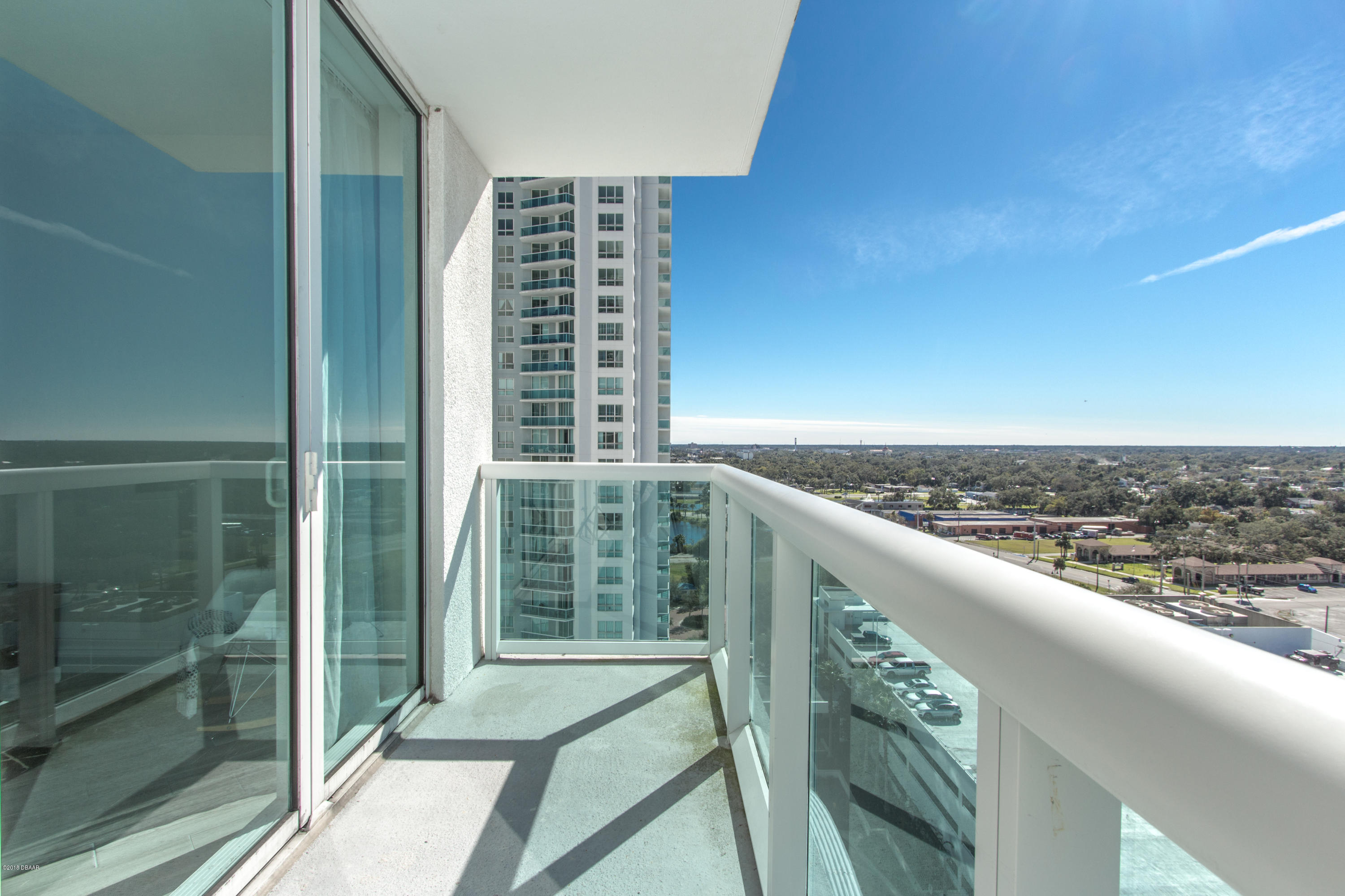 241 Riverside Drive, Unit 1409 Holly Hill, FL 32117 - Photo 17 of 35 a view of balcony with wooden floor and fence