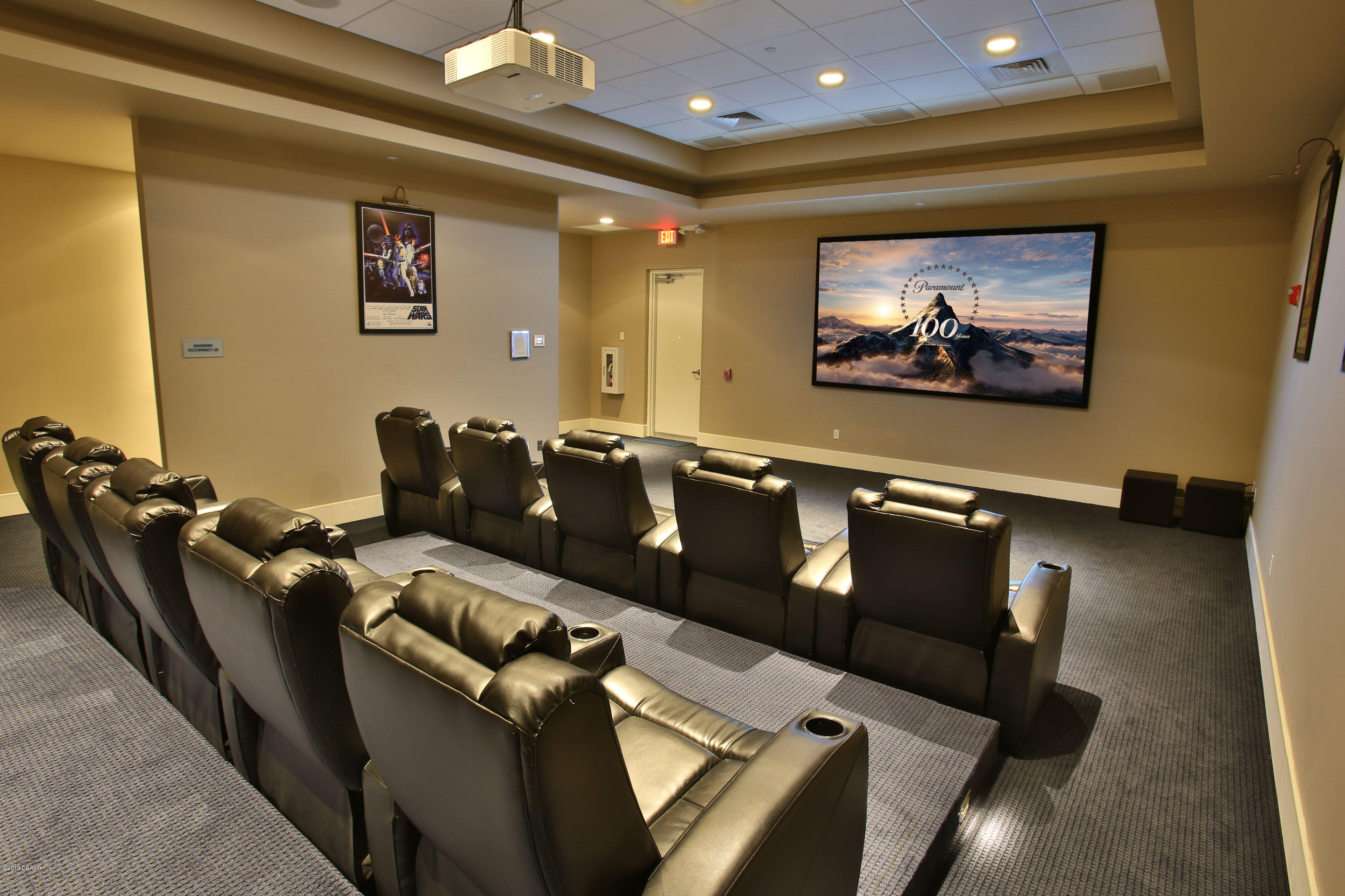 241 Riverside Drive, Unit 1409 Holly Hill, FL 32117 - Photo 31 of 35 a projector room with furniture