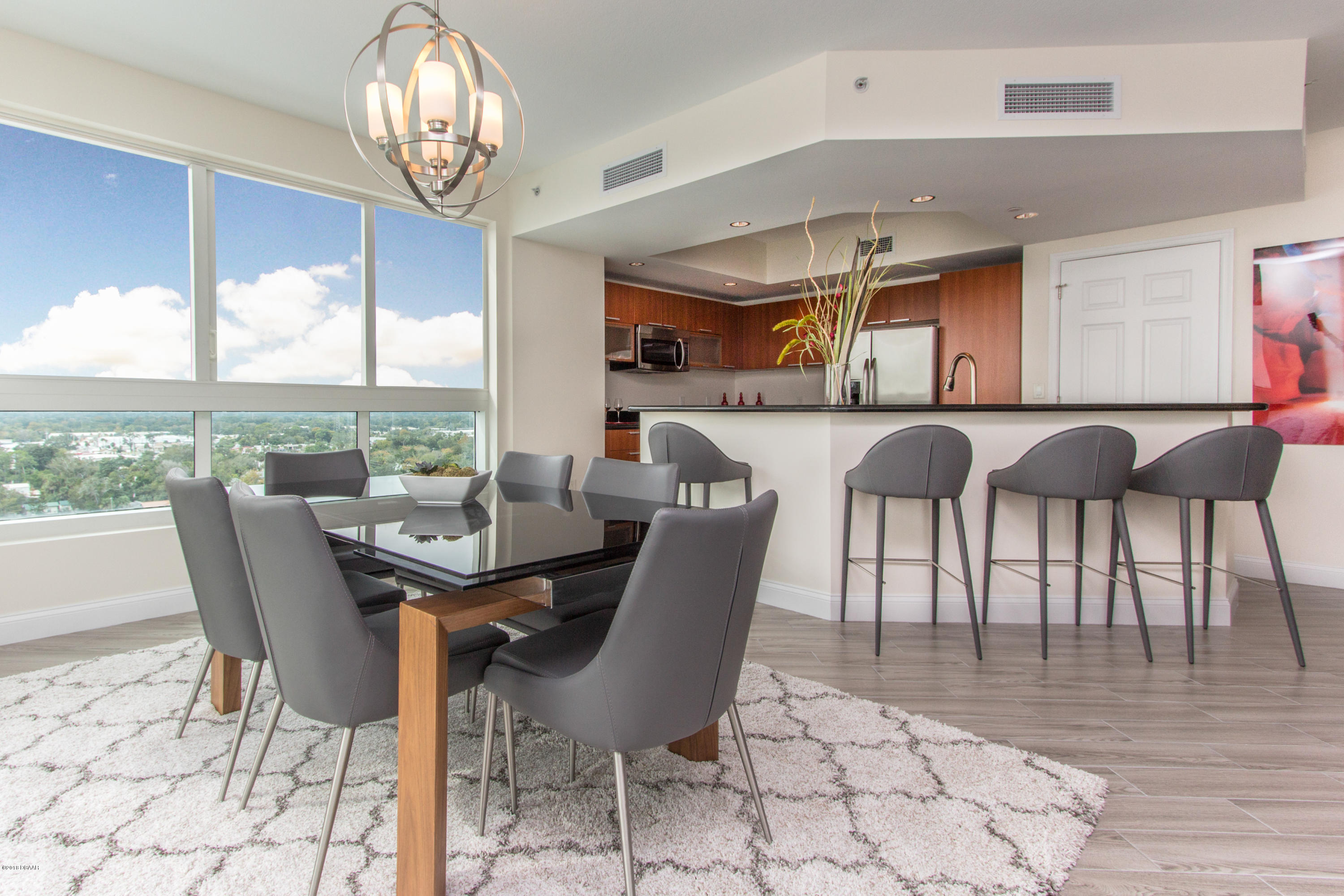 241 Riverside Drive, Unit 1409 Holly Hill, FL 32117 - Photo 6 of 35 a view of a dining room with furniture window and outside view