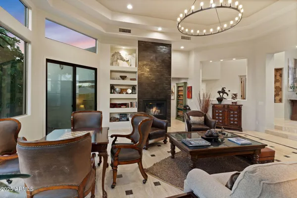 a kitchen with stainless steel appliances kitchen island granite countertop a sink stove and refrigerator