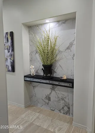 a bedroom with a bed and a glass door