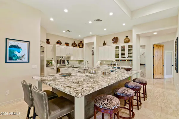a view of a dining room with furniture and a table