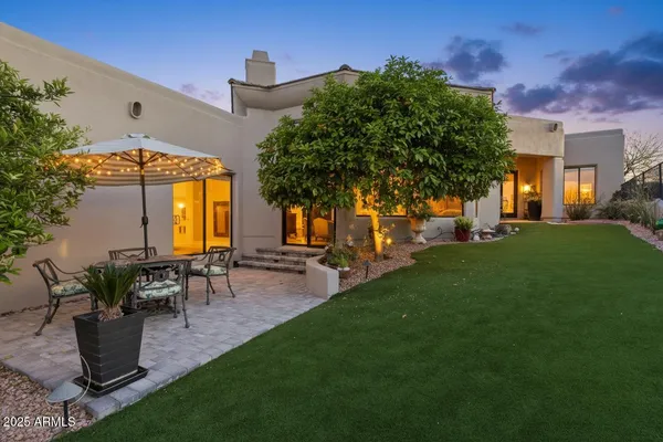 a view of swimming pool outdoor seating and city view