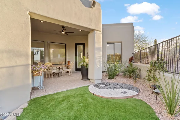 a view of a house with swimming pool and furniture