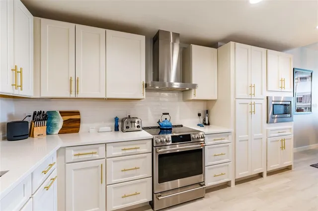 a room with a table chairs and a flat screen tv