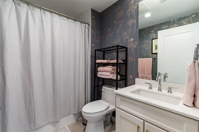 a bedroom with a bed and lamp