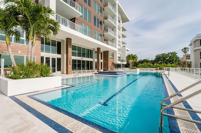 a view of a swimming pool and an outdoor space