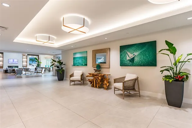 a room with pool table and windows