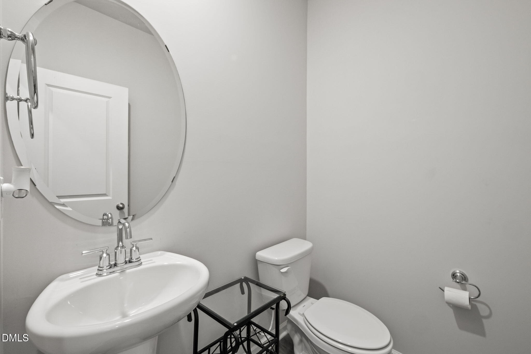 3000 Farndale Trace Durham, NC 27712 - Photo 15 of 36 a bathroom with a toilet sink and mirror