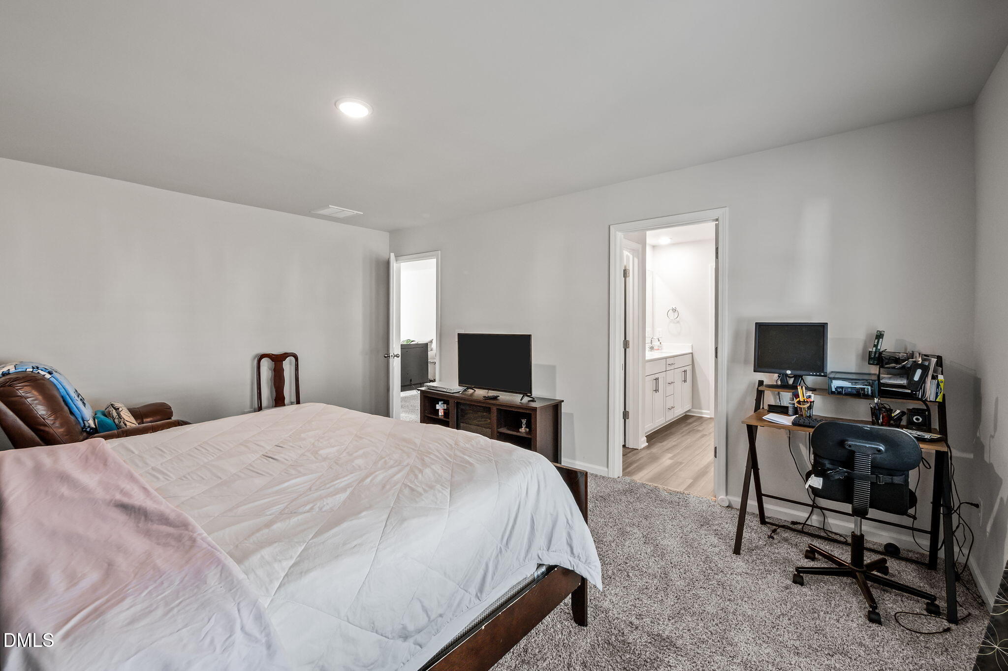 3000 Farndale Trace Durham, NC 27712 - Photo 17 of 36 a bedroom with a bed and a computer on a table
