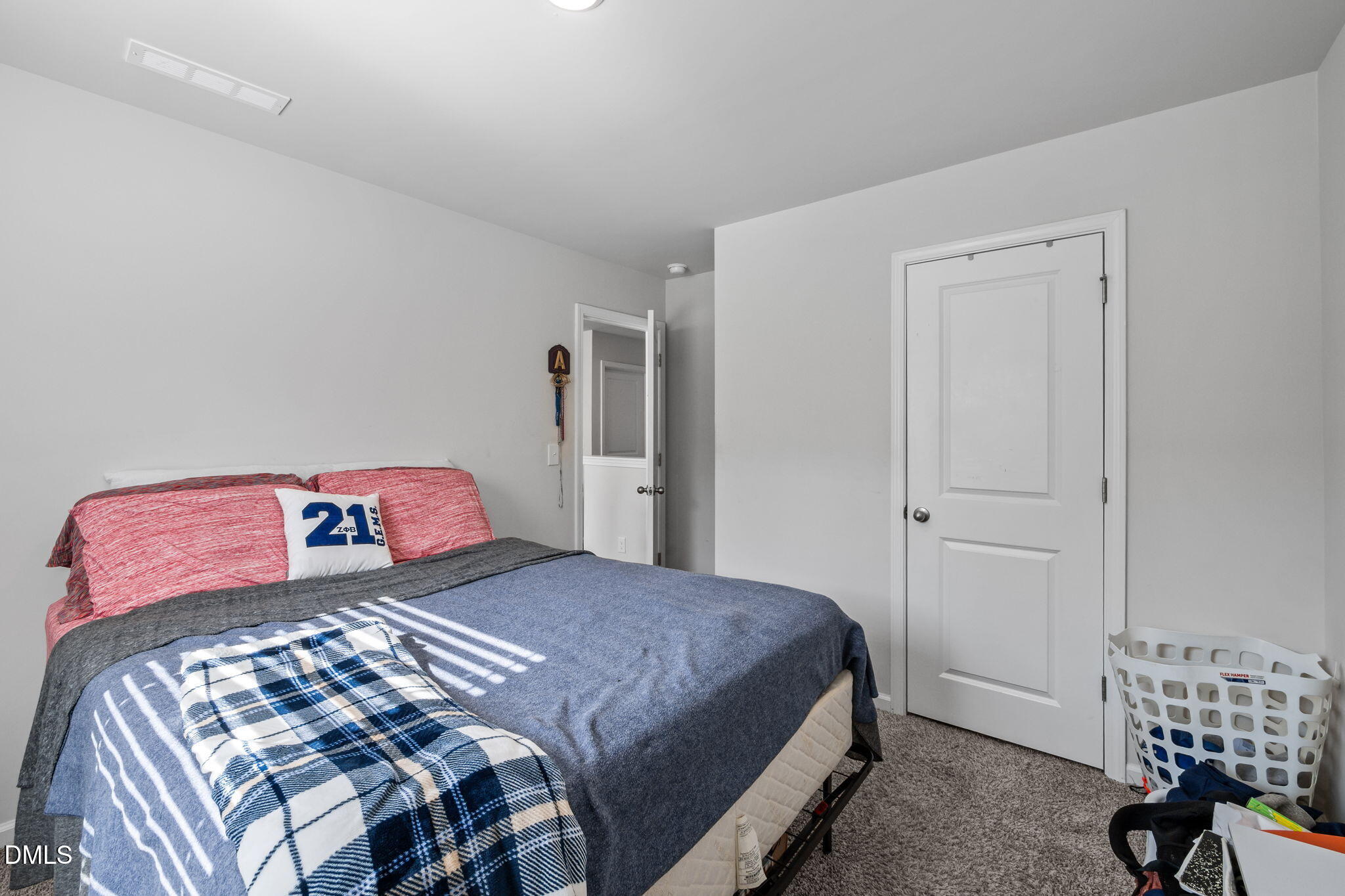 3000 Farndale Trace Durham, NC 27712 - Photo 20 of 36 a bedroom with a bed and a lamp on dresser