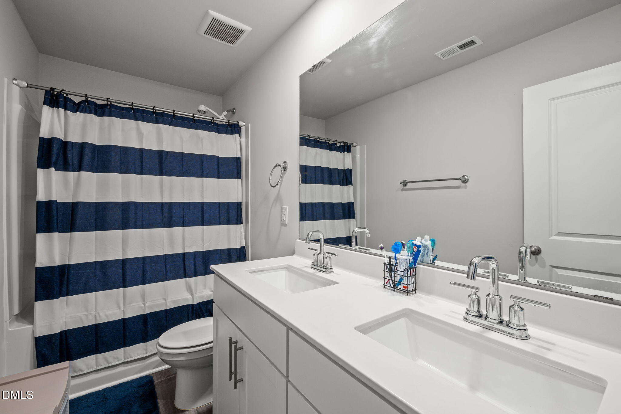 3000 Farndale Trace Durham, NC 27712 - Photo 24 of 36 a bathroom with a sink a toilet a shower and a mirror