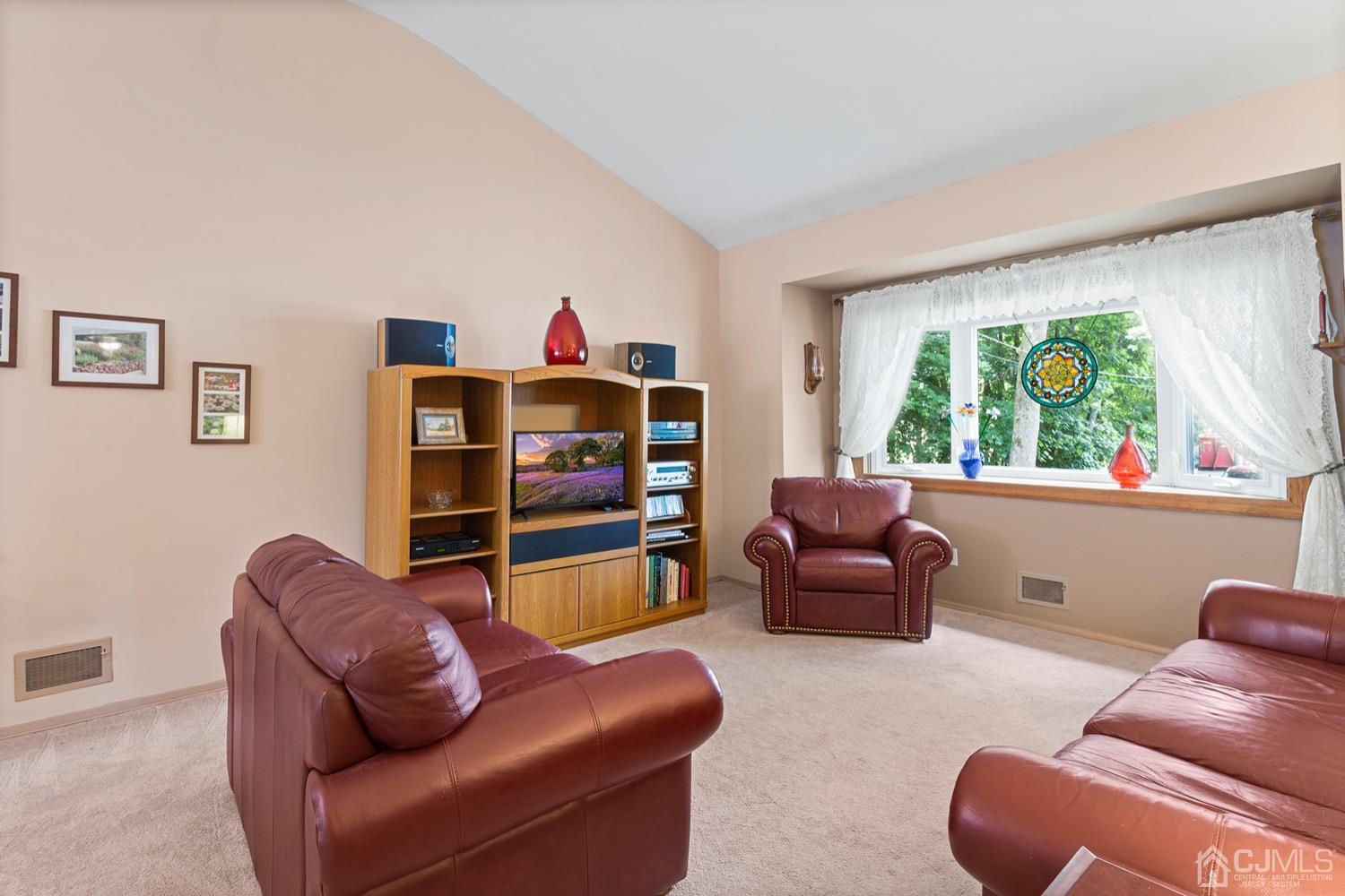 136 Lee Drive Middlesex, NJ 08846 - Photo 11 of 35 a living room with furniture and a large window