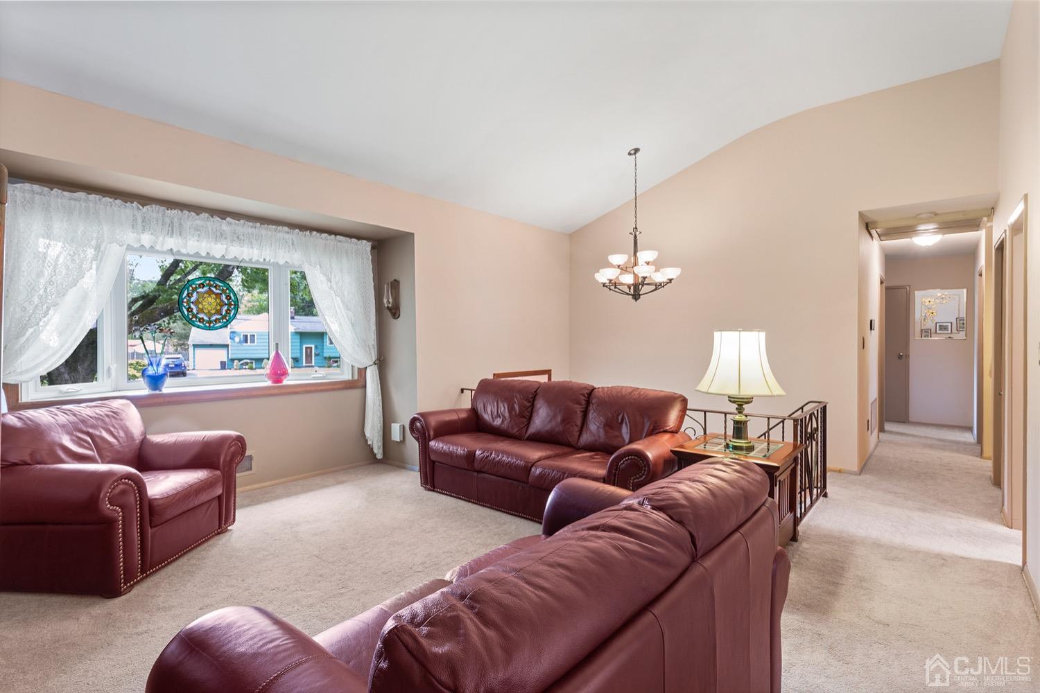 136 Lee Drive Middlesex, NJ 08846 - Photo 12 of 35 a living room with furniture a window and a painting