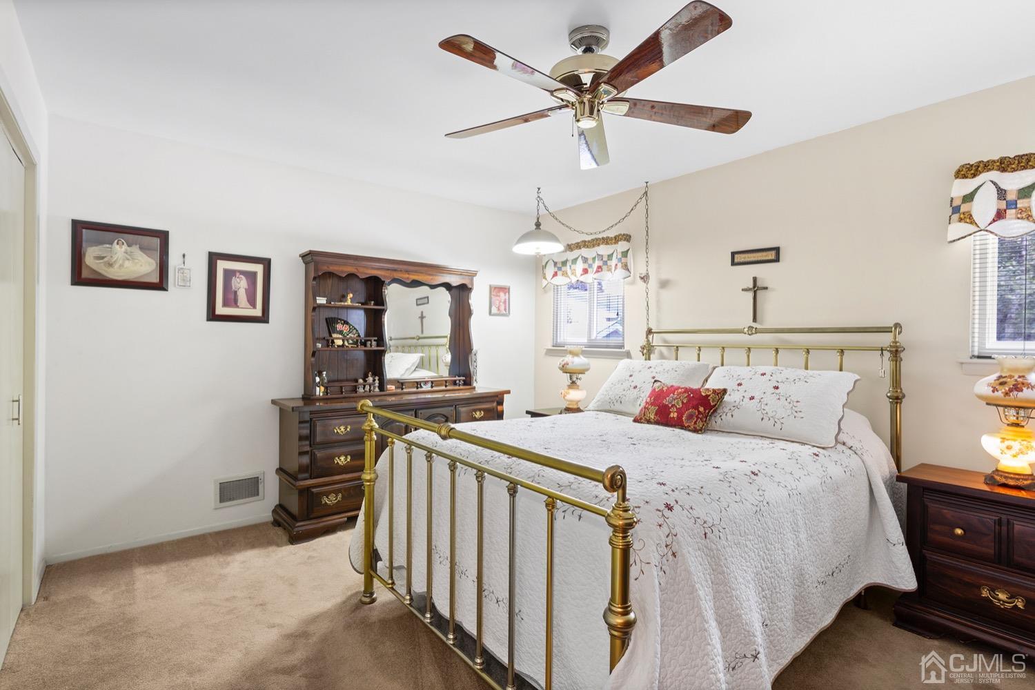 136 Lee Drive Middlesex, NJ 08846 - Photo 14 of 35 a bedroom with a bed and a chandelier