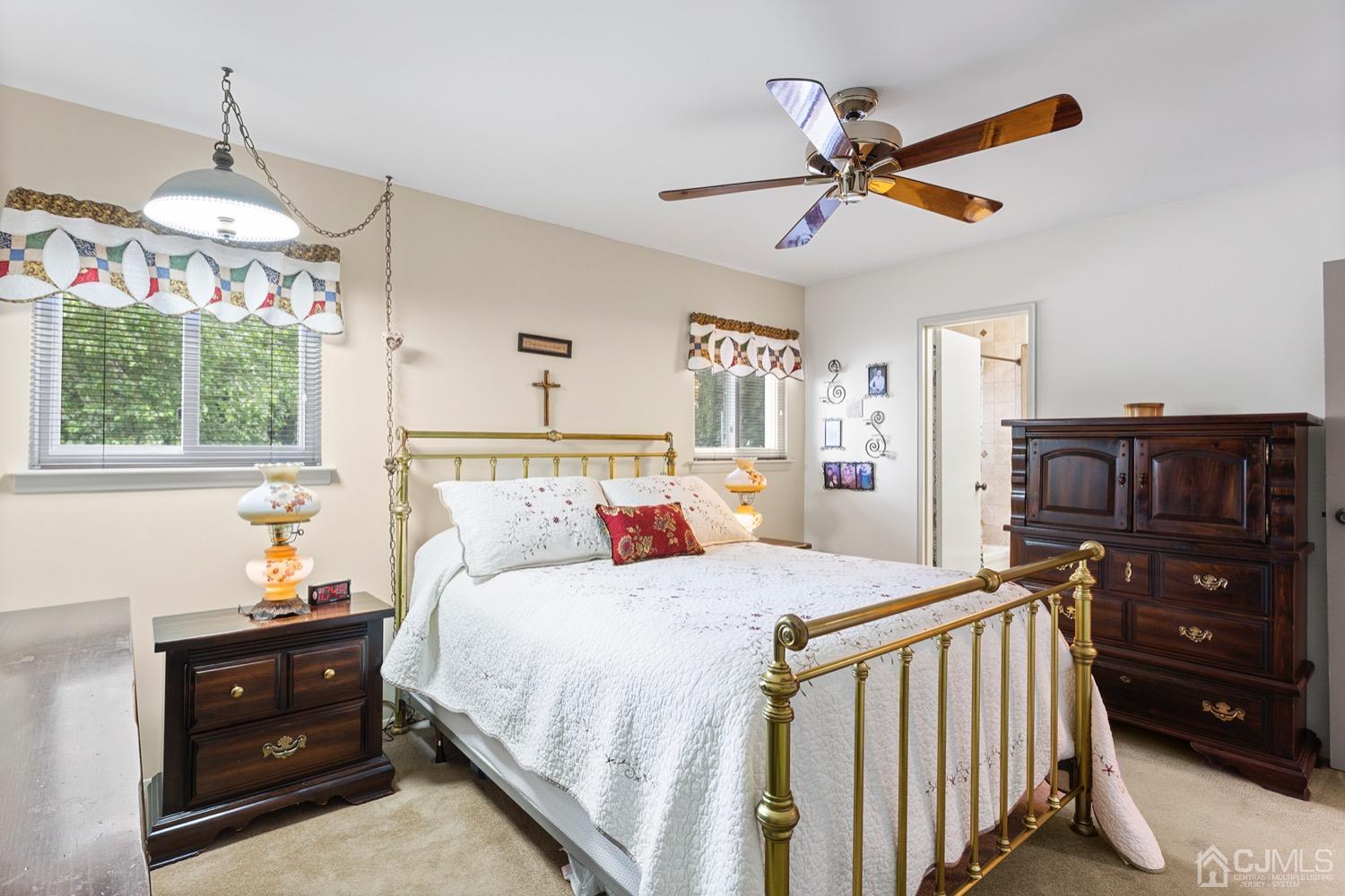 136 Lee Drive Middlesex, NJ 08846 - Photo 15 of 35 a bedroom with a bed and a chandelier