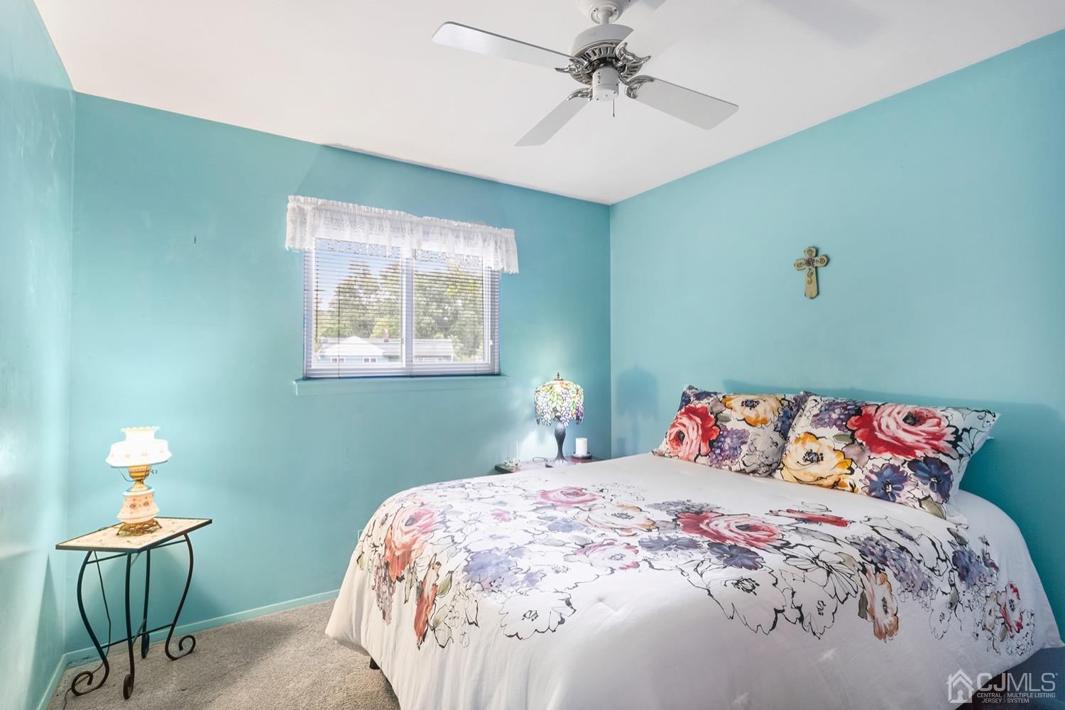 136 Lee Drive Middlesex, NJ 08846 - Photo 16 of 35 a bedroom with a bed and a chandelier