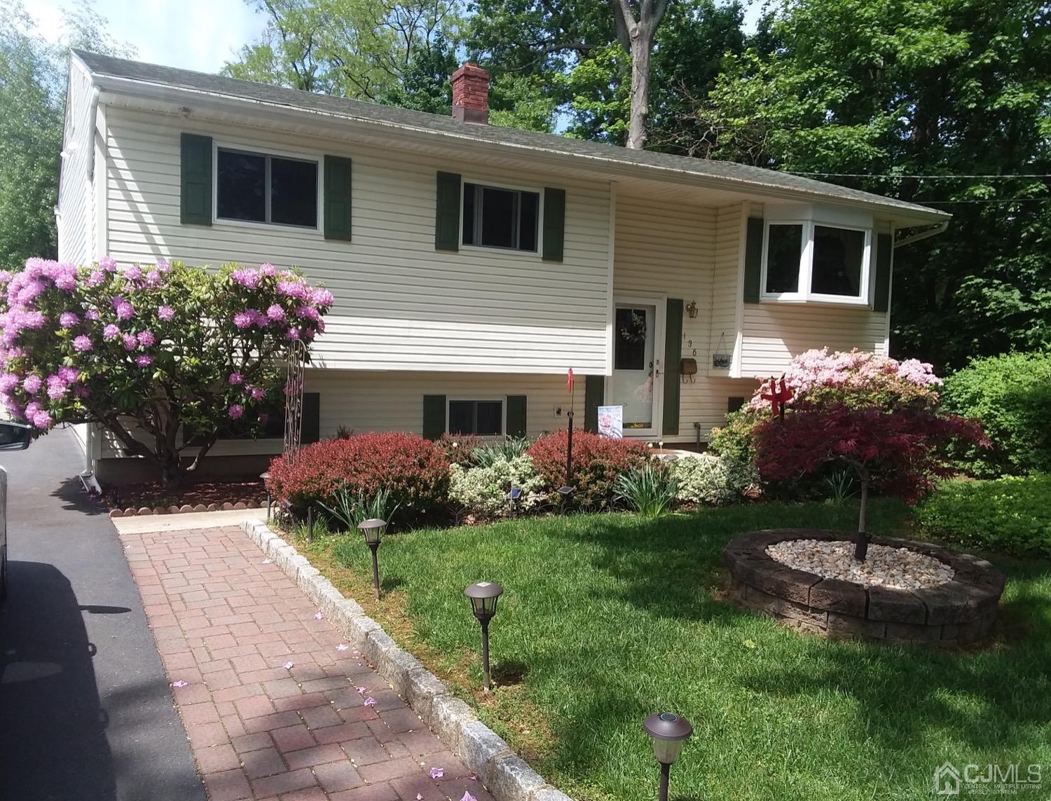 136 Lee Drive Middlesex, NJ 08846 - Photo 2 of 35 a front view of house with yard and green space