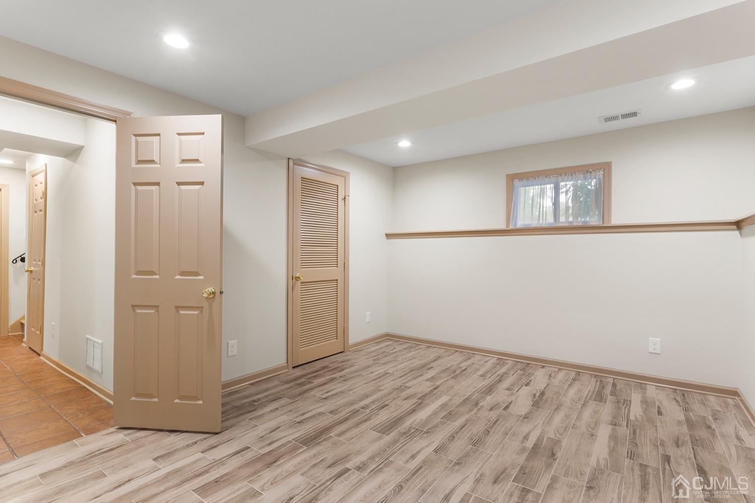 136 Lee Drive Middlesex, NJ 08846 - Photo 21 of 35 wooden floor in an empty room with a window