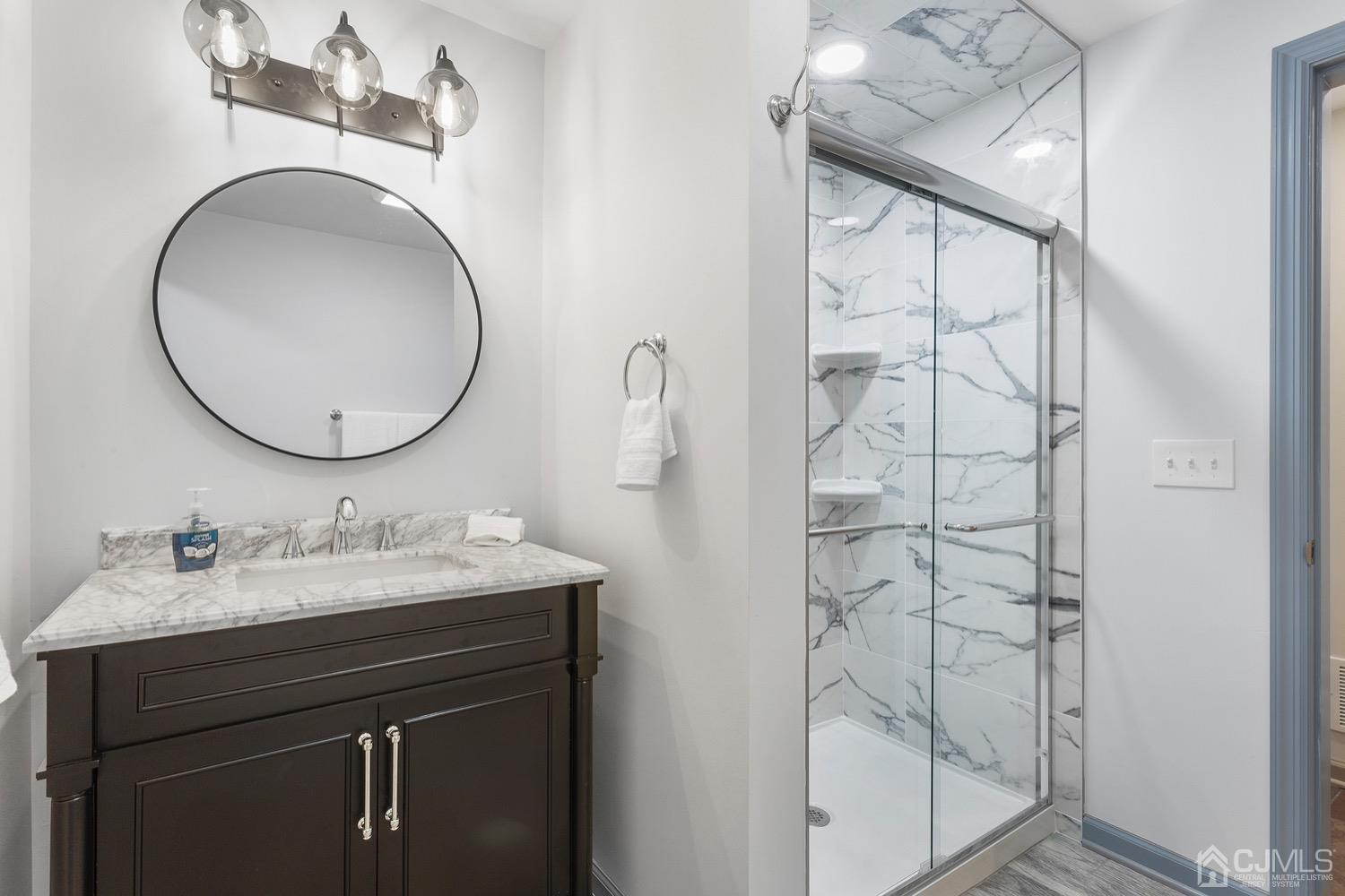 136 Lee Drive Middlesex, NJ 08846 - Photo 22 of 35 a bathroom with a sink and a mirror