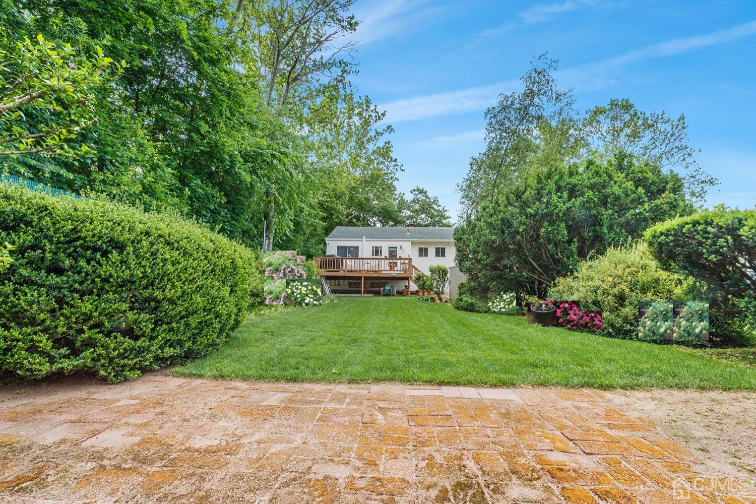 136 Lee Drive Middlesex, NJ 08846 - Photo 26 of 35 a view of a garden with trees and flowers