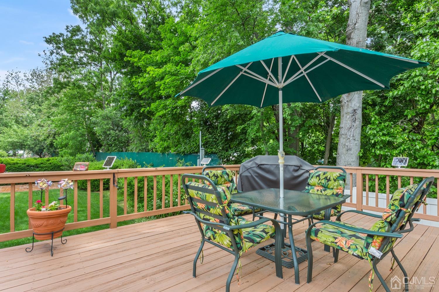 136 Lee Drive Middlesex, NJ 08846 - Photo 29 of 35 a deck with hardwood table and chairs