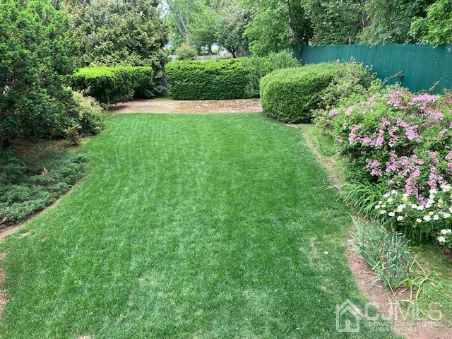 136 Lee Drive Middlesex, NJ 08846 - Photo 30 of 35 a view of a garden with a lake