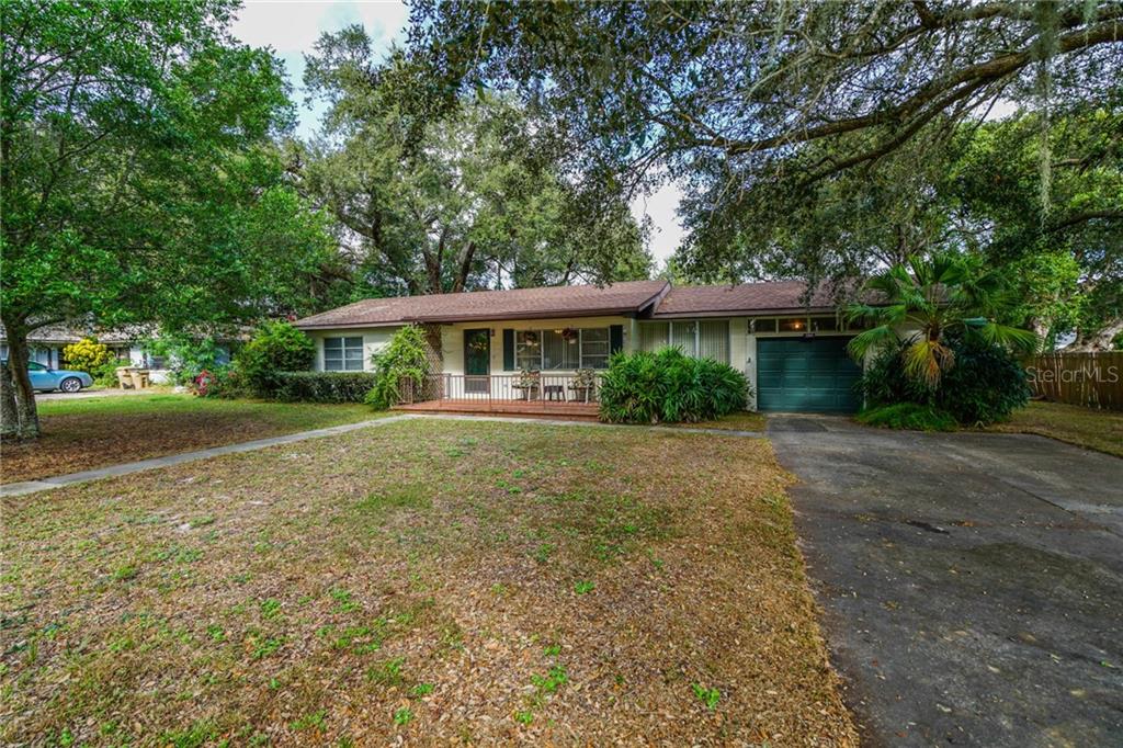 2269 Southland Road Mount Dora, FL 32757 - Photo 1 of 1 a front view of a house with yard and green space