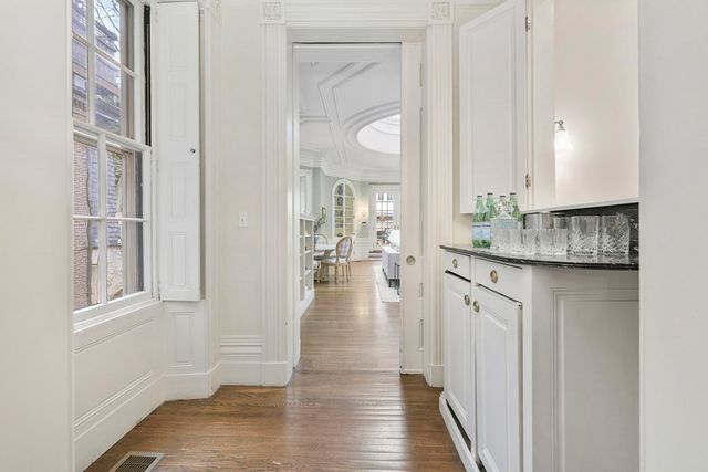a view of entryway with wooden floor and glass door