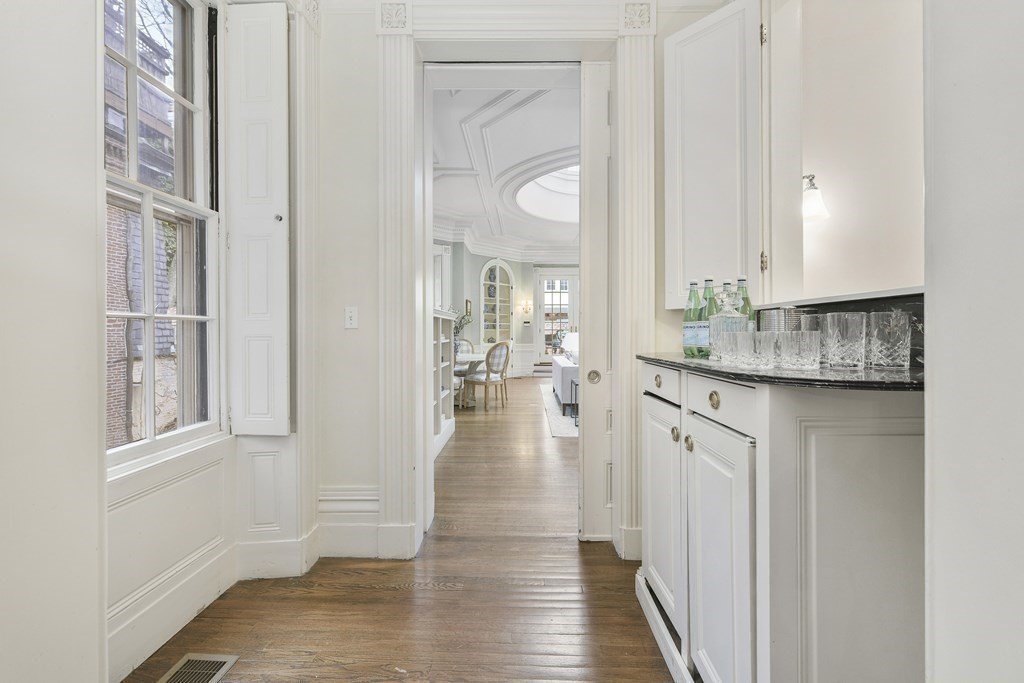 31 Chestnut Street Boston, MA 02108 - Photo 7 of 29 a view of a hallway with wooden floor windows and a bathroom