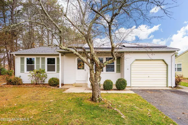 a front view of a house with a garage