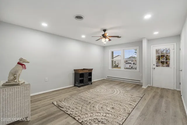 a view of a livingroom with wooden floor