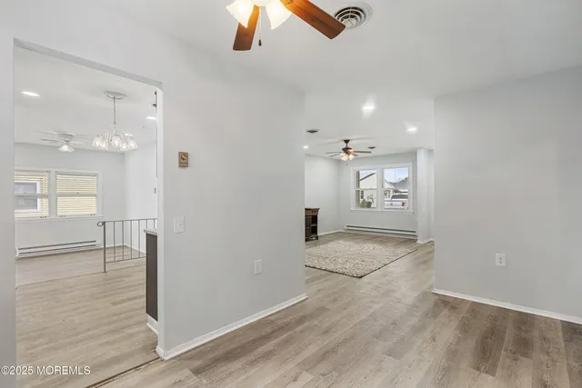 a kitchen with stainless steel appliances granite countertop a sink dishwasher a stove and a microwave oven with cabinets