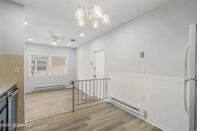 a view of a kitchen with a sink and an oven