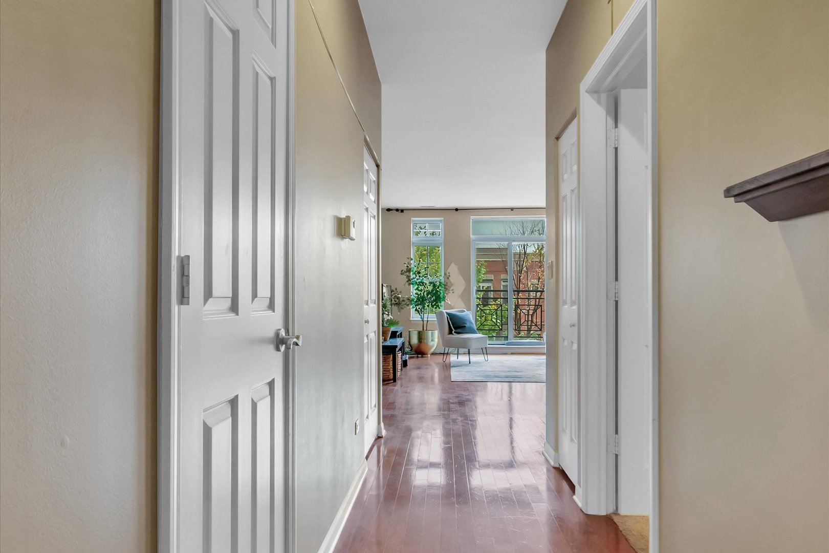 1414 South Halsted Street, Unit 3B Chicago, IL 60607 - Photo 11 of 14 a view of a hallway with wooden floor and furniture