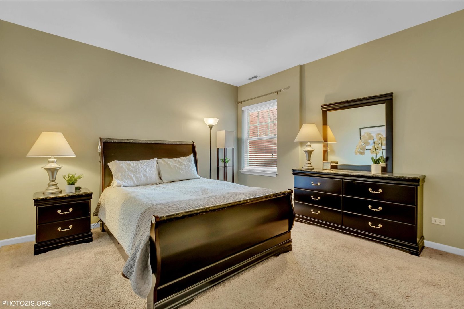 1414 South Halsted Street, Unit 3B Chicago, IL 60607 - Photo 7 of 14 a bedroom with a bed and a dresser