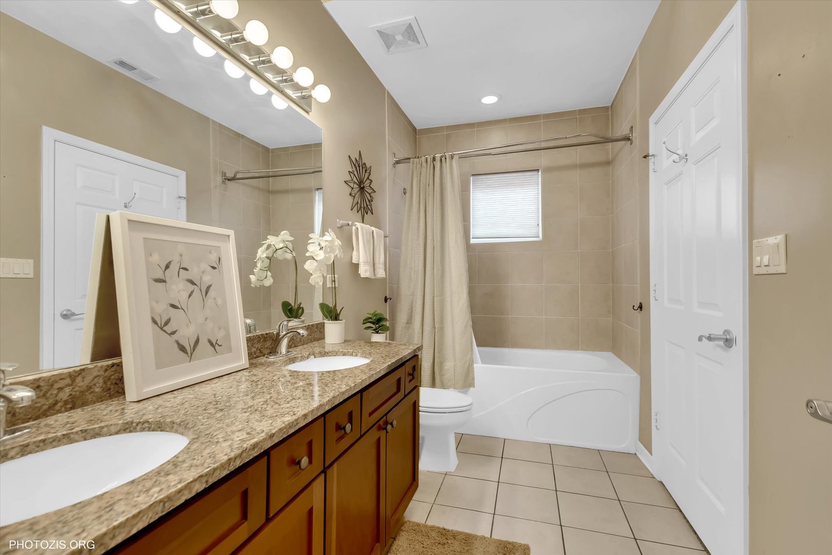 1414 South Halsted Street, Unit 3B Chicago, IL 60607 - Photo 8 of 14 a bathroom with a granite countertop sink a mirror and a shower