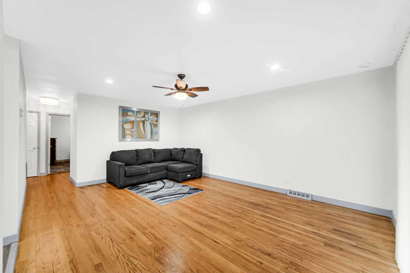16607 Robey Street Markham, IL 60428 - Photo 13 of 24 a living room with furniture and a wooden floor