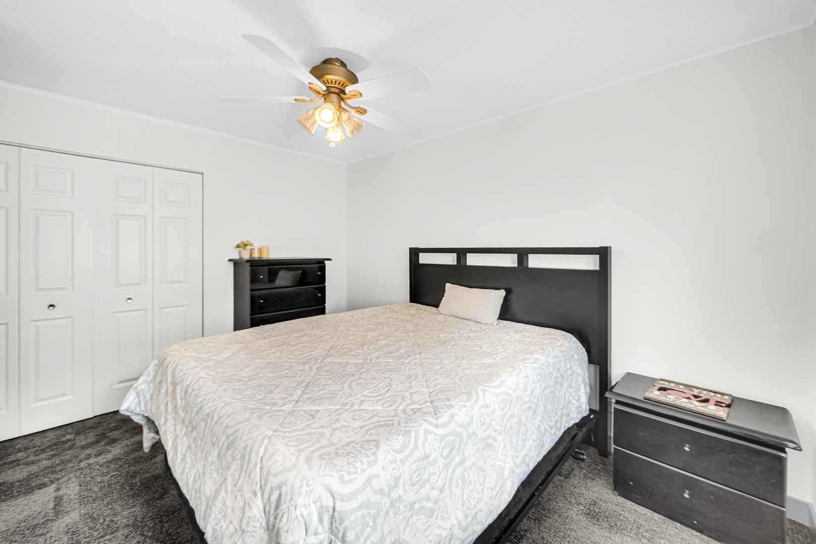 16607 Robey Street Markham, IL 60428 - Photo 17 of 24 a bedroom with a bed and a chandelier